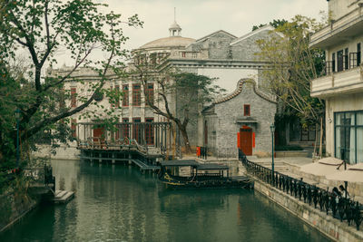 Canal amidst buildings in city