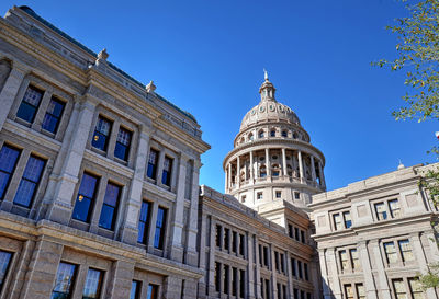 Low angle view of building against blue sky