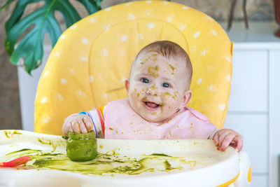 Portrait of cute baby boy in bathtub