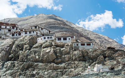 Houses against sky during winter