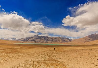 Panoramic view of arid landscape against sky