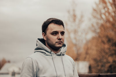 Portrait of young man looking away