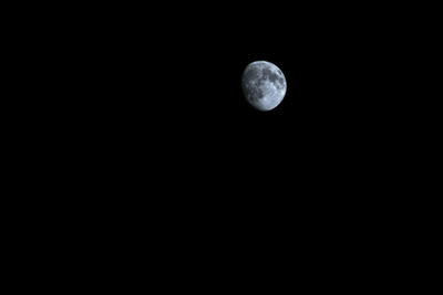 Low angle view of moon against clear sky at night