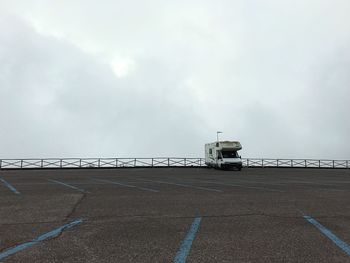 Road by sea against sky