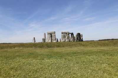 Built structure on field against sky