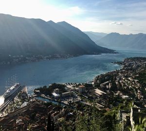 High angle view of buildings by sea against sky