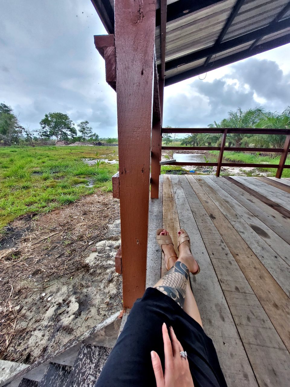 personal perspective, one person, cloud, nature, sky, wood, leisure activity, adult, human leg, lifestyles, low section, relaxation, day, landscape, outdoors, land, human foot, limb, water, plant, women, trip, holiday, vacation, men, scenics - nature, architecture, tranquility, barefoot, human limb, environment, tranquil scene, hand, tree