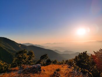 Scenic view of mountains against sky during sunset