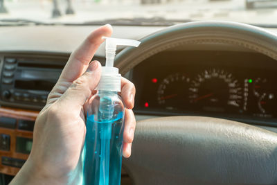 Close-up of hand holding car