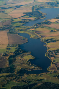 Aerial view of river amidst landscape on sunny day