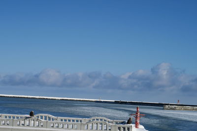 Scenic view of sea against blue sky