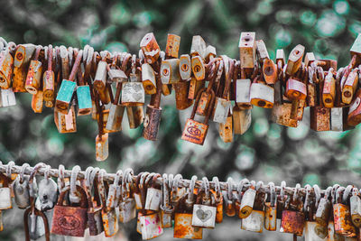 Close-up of padlocks hanging on metal