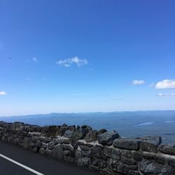 Scenic view of sea against blue sky