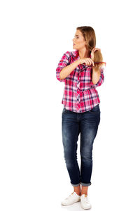 Portrait of woman standing against white background