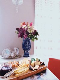 Close-up of flower vase on table at home