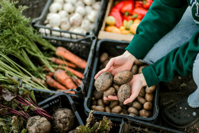 Midsection of man preparing food for sale at market