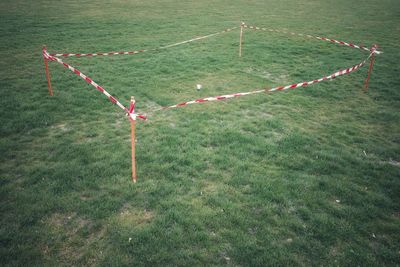 High angle view of shuttlecock on grass at park