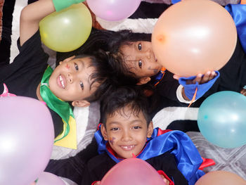 Happy child with colorful balloons. birthday party. creative trends initiative - localized per