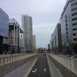 Road along buildings in city