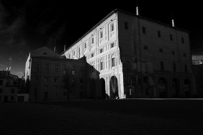 Low angle view of old building against sky at night