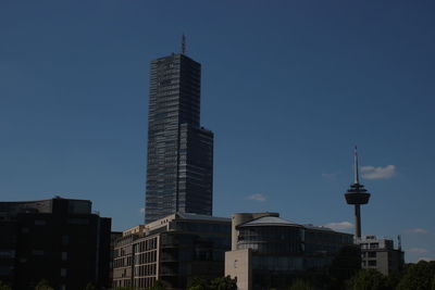 Low angle view of buildings against blue sky