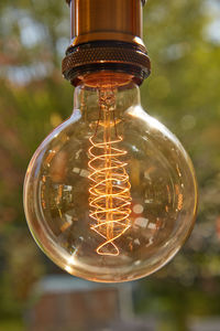 Close-up of illuminated light bulb