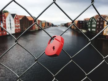 Close-up of love lock on chainlink fence