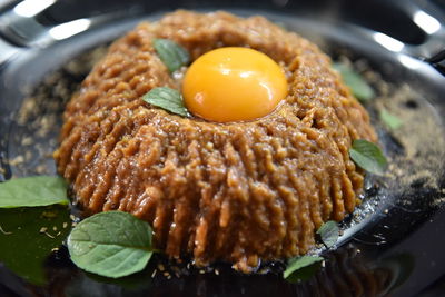 Close-up of breakfast served in plate tartar steak