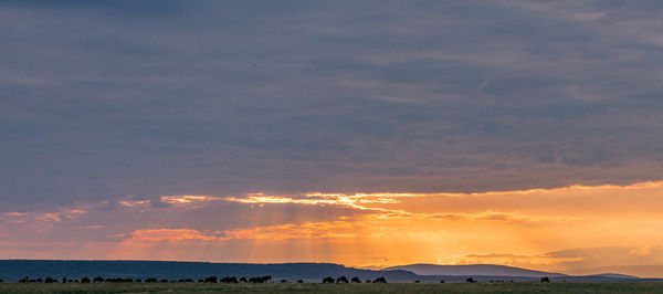 Scenic view of silhouette landscape against sky during sunset