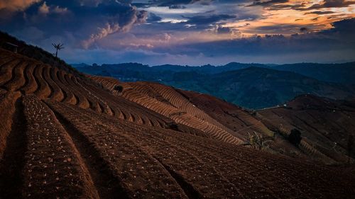 Scenic view of landscape against sky during sunset