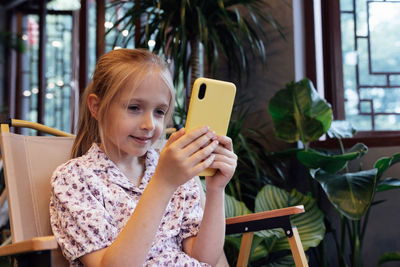 Young woman using mobile phone