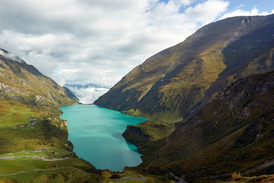 Scenic view of lake against cloudy sky