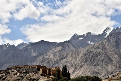 Low angle view of mountain range against sky