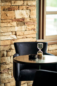 View of wine glass on table against wall