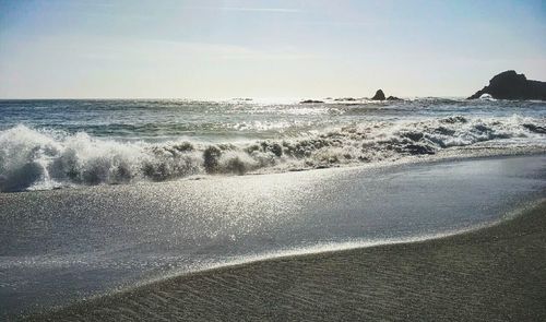 Scenic view of beach against sky