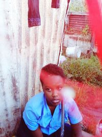 Portrait of young man looking away outdoors