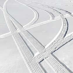Full frame shot of tire tracks on snow