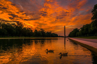 Scenic view of lake against sky during sunset