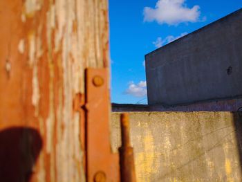 Close-up of metal wall against building