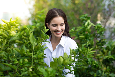 Portrait of smiling young woman outdoors