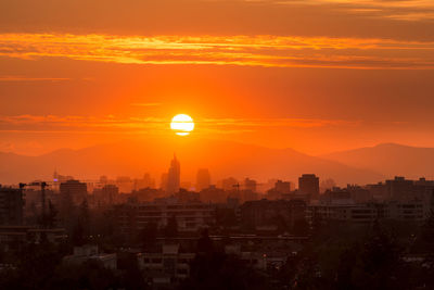 Panoramic view of downtown santiago de chile with the setting sun.