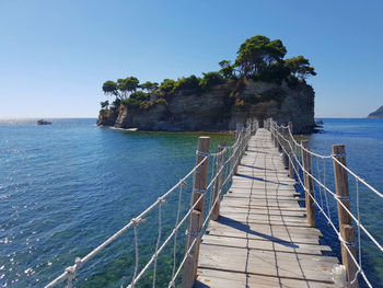 Scenic view of sea against clear blue sky