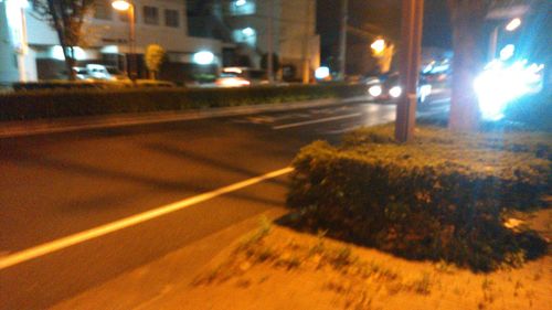 Close-up of illuminated street at night