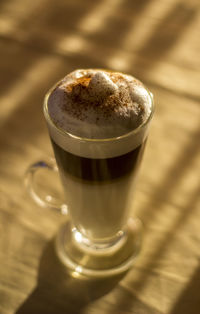 High angle view of coffee on wooden table