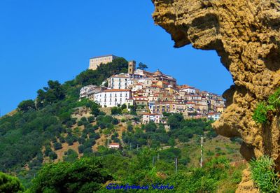 Low angle view of buildings against blue sky