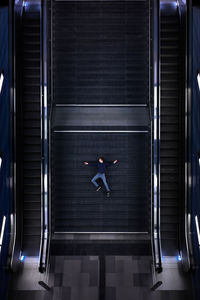 Man lying down on steps