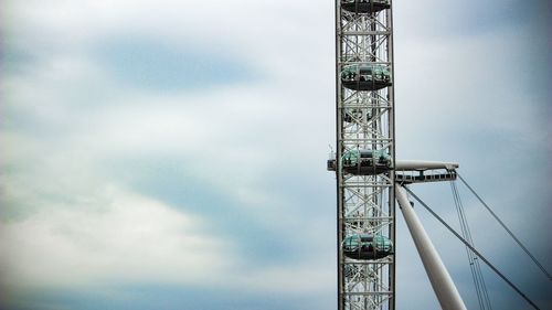 Low angle view of crane against sky