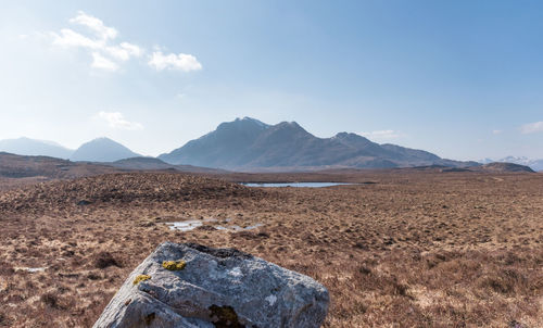 Scenic view of arid landscape against sky