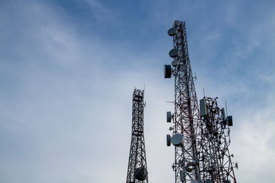 Low angle view of communications tower against sky