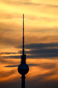 Silhouette tower against sky during sunset